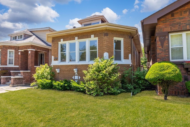 8510 S Blackstone Ave, Chicago, IL 60619 - view of front of house with brick siding and a front yard