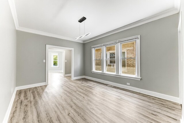 8510 S Blackstone Ave, Chicago, IL 60619 - empty room featuring ornamental molding and wood finished floors
