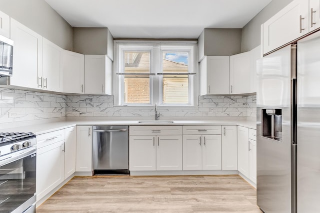 8510 S Blackstone Ave, Chicago, IL 60619 - kitchen with appliances with stainless steel finishes and white cabinetry