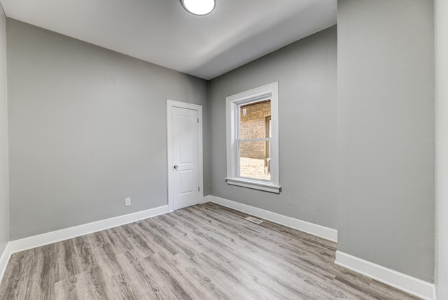 8510 S Blackstone Ave, Chicago, IL 60619 - spare room featuring light wood finished floors