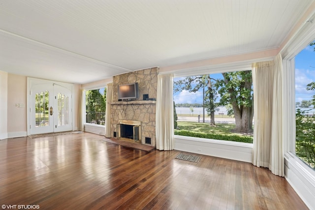 691 Lake Ave, Crystal Lake, IL 60014 - unfurnished living room with hardwood / wood-style flooring and a fireplace