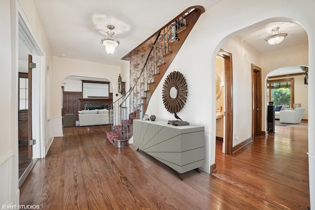 691 Lake Ave, Crystal Lake, IL 60014 - hall featuring wood finished floors, arched walkways, and stairway
