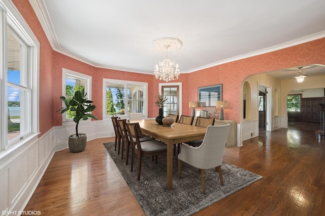 691 Lake Ave, Crystal Lake, IL 60014 - dining space featuring arched walkways, ornamental molding, a chandelier, wood finished floors, and wainscoting