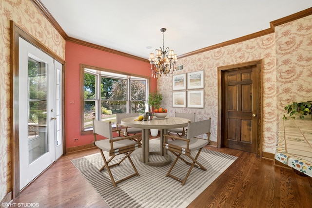 691 Lake Ave, Crystal Lake, IL 60014 - dining area featuring crown molding, wallpapered walls, wood finished floors, and a chandelier