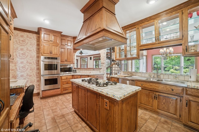 691 Lake Ave, Crystal Lake, IL 60014 - kitchen with appliances with stainless steel finishes, light countertops, custom range hood, a center island, and light tile patterned flooring