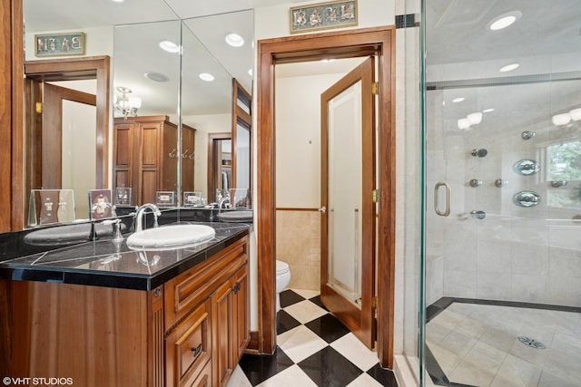 691 Lake Ave, Crystal Lake, IL 60014 - bathroom with vanity, a stall shower, tile walls, a wainscoted wall, and recessed lighting
