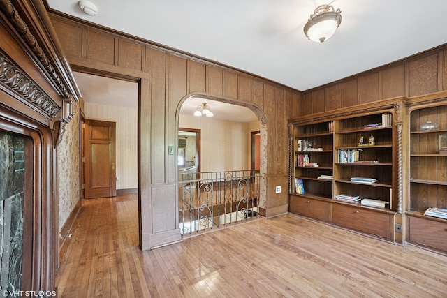 691 Lake Ave, Crystal Lake, IL 60014 - unfurnished room with a smoke detector, hardwood / wood-style floors, and arched walkways