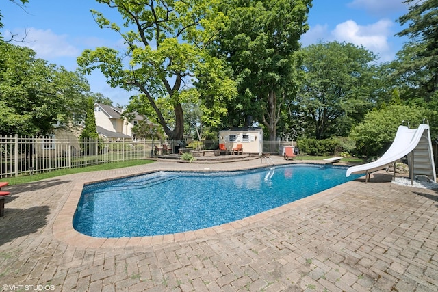 691 Lake Ave, Crystal Lake, IL 60014 - view of pool with a patio, a diving board, and a water slide