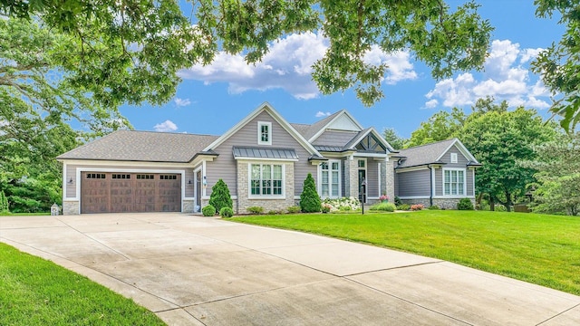 1311 Hickory Tree Ct, Mahomet, IL 61853 - craftsman house featuring stone siding, a garage, driveway, and a front yard