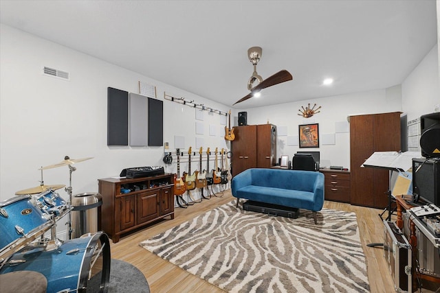 1311 Hickory Tree Ct, Mahomet, IL 61853 - living room with light wood-type flooring, an office area, and a ceiling fan