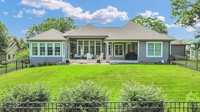1311 Hickory Tree Ct, Mahomet, IL 61853 - rear view of house featuring a fenced backyard, a patio area, and a shingled roof