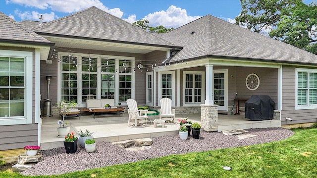 1311 Hickory Tree Ct, Mahomet, IL 61853 - rear view of house with a shingled roof and a patio area