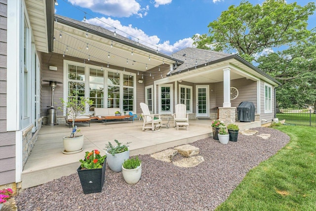 1311 Hickory Tree Ct, Mahomet, IL 61853 - back of property with a patio area and roof with shingles