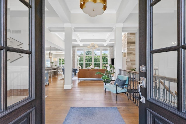 1311 Hickory Tree Ct, Mahomet, IL 61853 - foyer featuring a chandelier, coffered ceiling, wood finished floors, beamed ceiling, and ornamental molding