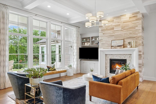 1311 Hickory Tree Ct, Mahomet, IL 61853 - living area with coffered ceiling, hardwood / wood-style flooring, beamed ceiling, plenty of natural light, and a tiled fireplace