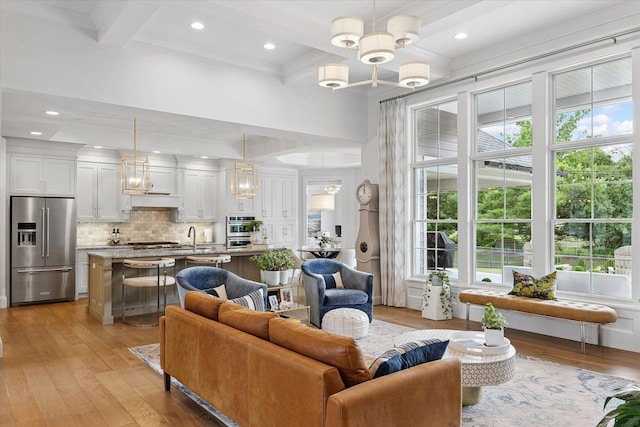 1311 Hickory Tree Ct, Mahomet, IL 61853 - living area with healthy amount of natural light, light wood-style floors, coffered ceiling, beam ceiling, and recessed lighting