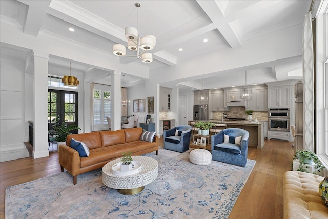 1311 Hickory Tree Ct, Mahomet, IL 61853 - living room with coffered ceiling, light wood-type flooring, beam ceiling, crown molding, and recessed lighting