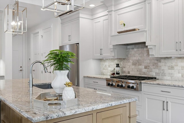 1311 Hickory Tree Ct, Mahomet, IL 61853 - kitchen with stainless steel appliances, a center island with sink, backsplash, a chandelier, and light stone countertops