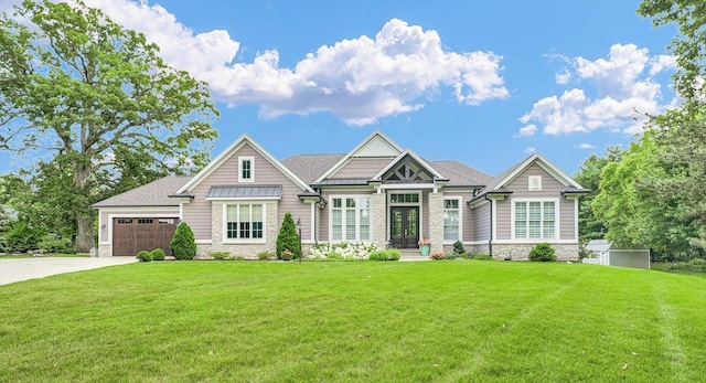 1311 Hickory Tree Ct, Mahomet, IL 61853 - craftsman-style home with stone siding, french doors, a front yard, and a garage