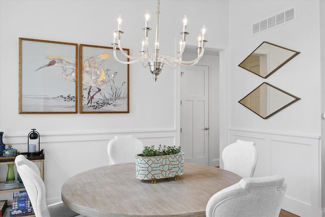 1311 Hickory Tree Ct, Mahomet, IL 61853 - dining space with a chandelier and a decorative wall