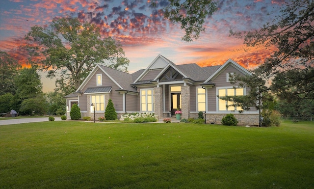 1311 Hickory Tree Ct, Mahomet, IL 61853 - craftsman-style house featuring stone siding and a front yard