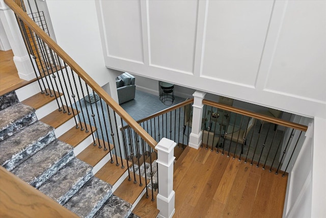 1311 Hickory Tree Ct, Mahomet, IL 61853 - staircase featuring wood finished floors