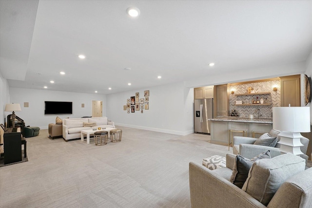 1311 Hickory Tree Ct, Mahomet, IL 61853 - living area with light colored carpet, recessed lighting, and wet bar