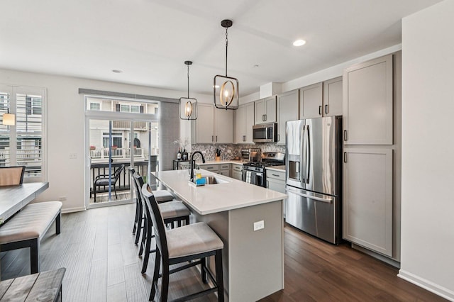 30W003 Brayman Ct, Warrenville, IL 60563 - kitchen with stainless steel appliances, gray cabinetry, dark wood-type flooring, light countertops, and recessed lighting
