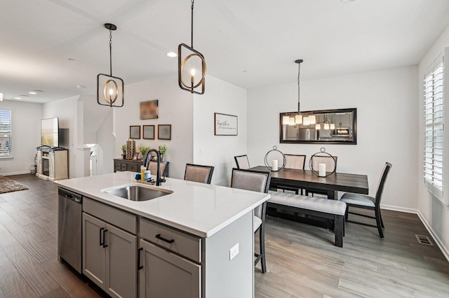 30W003 Brayman Ct, Warrenville, IL 60563 - kitchen with stainless steel dishwasher, plenty of natural light, gray cabinetry, light countertops, and recessed lighting