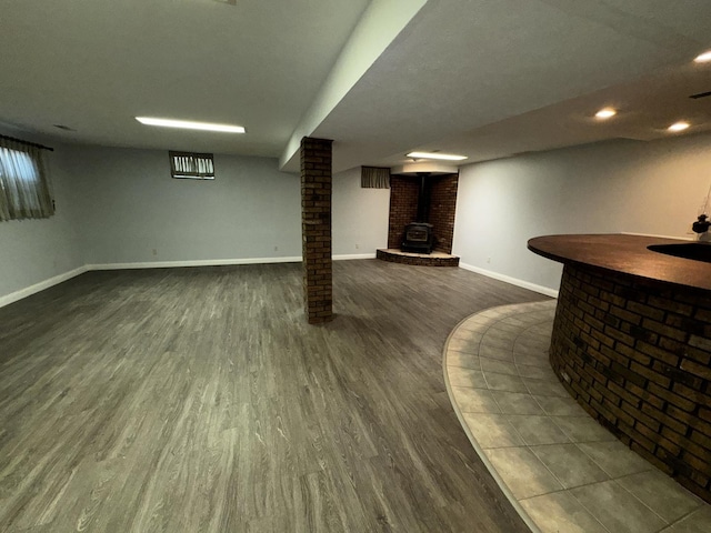 400 N Cottage Ave, Normal, IL 61761 - finished below grade area featuring dark wood-style flooring, recessed lighting, and a wood stove