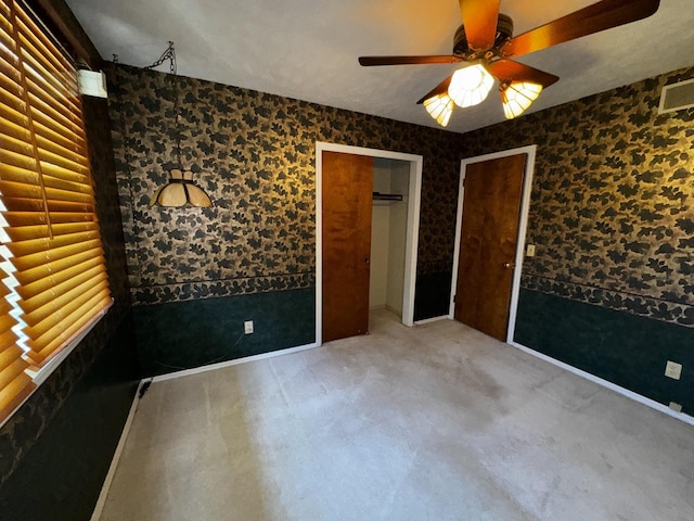400 N Cottage Ave, Normal, IL 61761 - unfurnished bedroom featuring ceiling fan and carpet floors