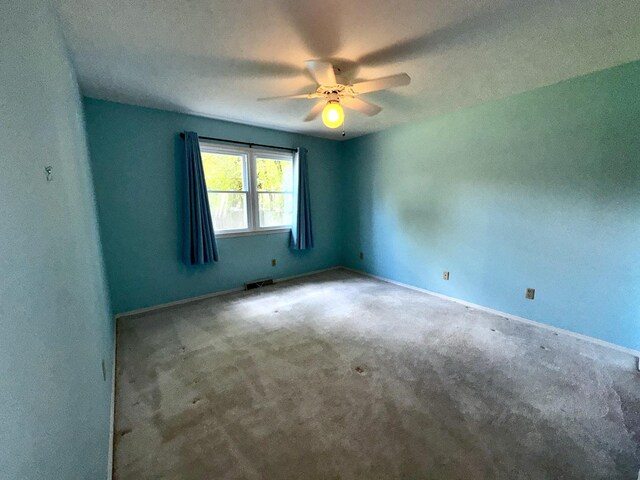 400 N Cottage Ave, Normal, IL 61761 - carpeted empty room with a ceiling fan and baseboards