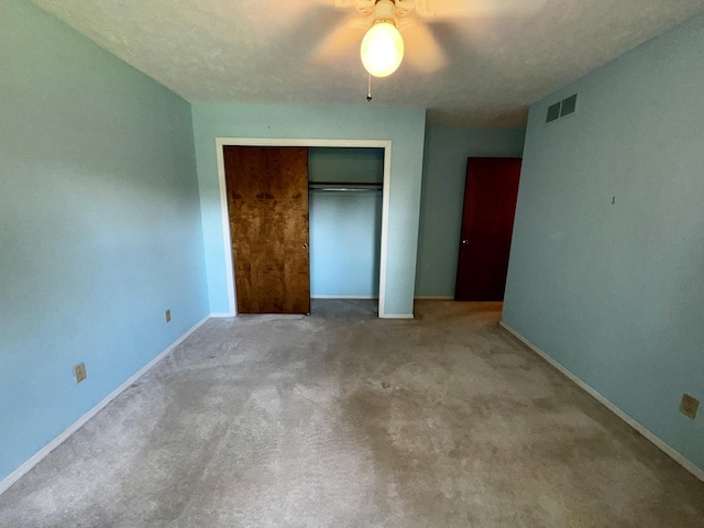 400 N Cottage Ave, Normal, IL 61761 - unfurnished bedroom with a closet, carpet, and a ceiling fan