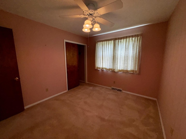 400 N Cottage Ave, Normal, IL 61761 - unfurnished bedroom featuring a closet, carpet, and a ceiling fan