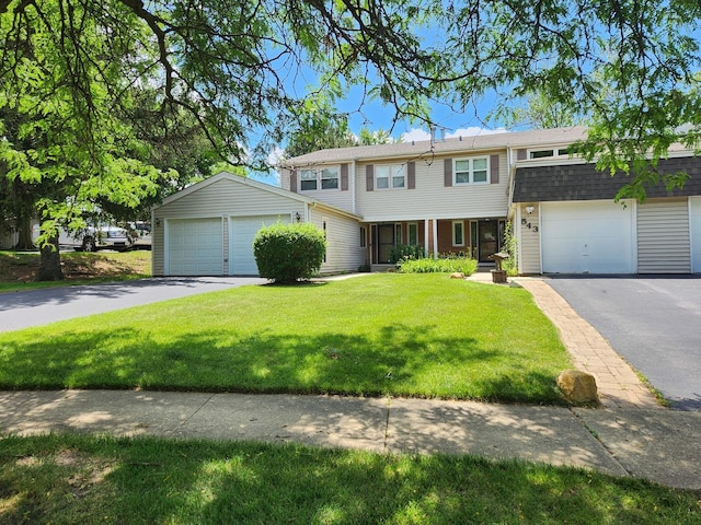 543 Norman Rd Unit 543, Bolingbrook, IL 60440 - view of front of house with a garage, a front yard, and a shingled roof