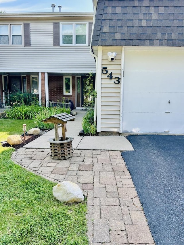 543 Norman Rd Unit 543, Bolingbrook, IL 60440 - doorway to property with brick siding and roof with shingles