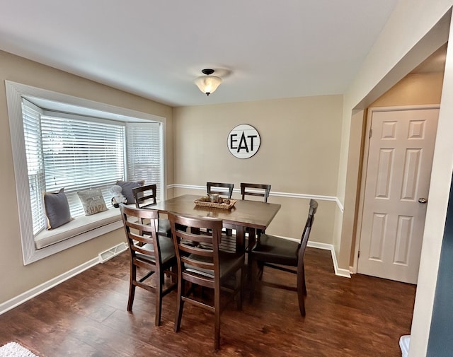 543 Norman Rd Unit 543, Bolingbrook, IL 60440 - dining space featuring dark wood-style floors and baseboards