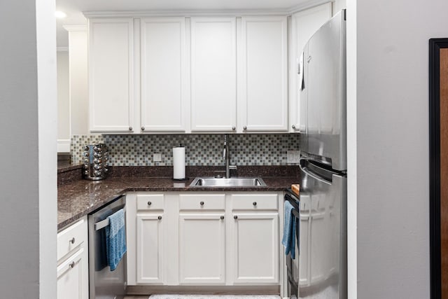 1811 Four Lakes Ave Unit 1H, Lisle, IL 60532 - kitchen featuring appliances with stainless steel finishes, white cabinets, decorative backsplash, and dark stone countertops