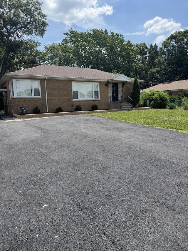 14911 Woodlawn Ave, Dolton, IL 60419 - view of front of property featuring brick siding and a front lawn