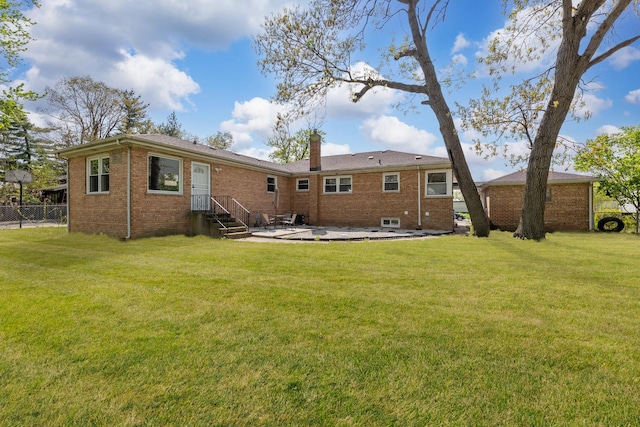 14911 Woodlawn Ave, Dolton, IL 60419 - back of property featuring brick siding, a patio, and a chimney
