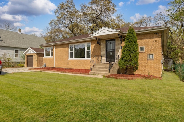 14911 Woodlawn Ave, Dolton, IL 60419 - view of front facade with brick siding, an outbuilding, and driveway