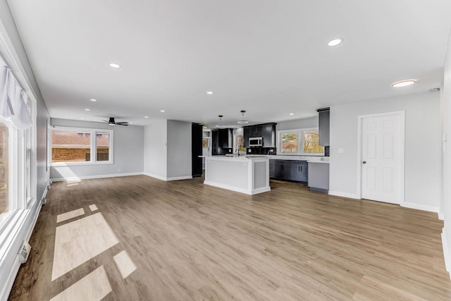14911 Woodlawn Ave, Dolton, IL 60419 - unfurnished living room with light wood-type flooring, recessed lighting, and ceiling fan