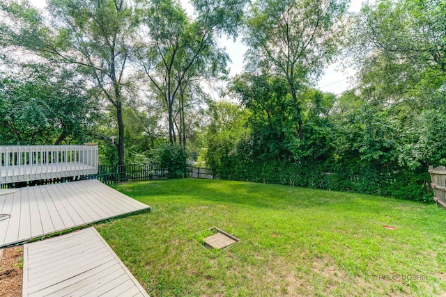 24 Hickory Rd, Oakwood Hills, IL 60013 - view of yard featuring a wooden deck and view of scattered trees