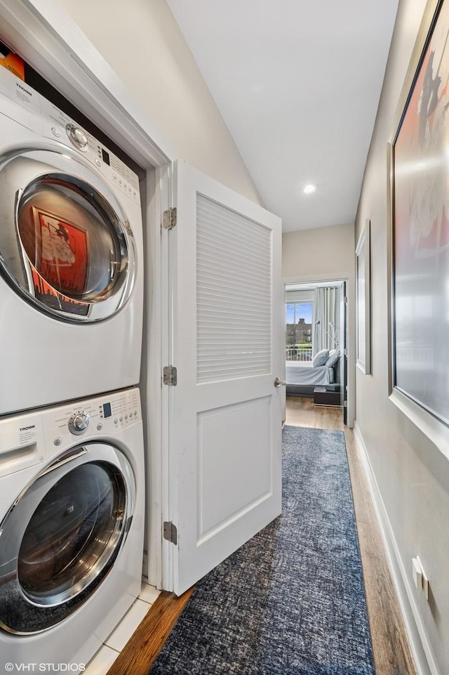 3255 N Paulina St Unit 4A, Chicago, IL 60657 - laundry area with stacked washer / dryer, wood finished floors, and recessed lighting