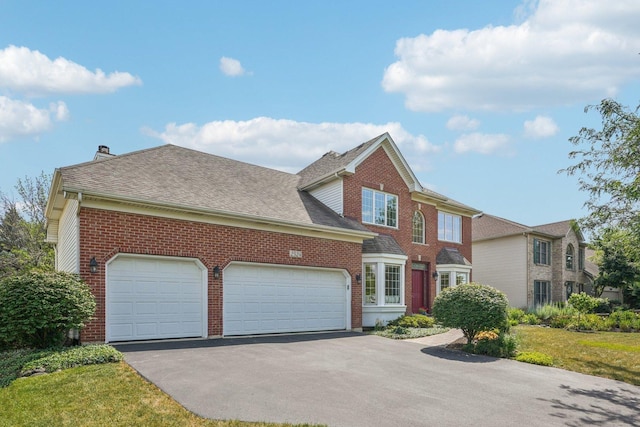 2524 Wild Timothy Rd, Naperville, IL 60564 - view of front of house featuring brick siding, a garage, asphalt driveway, and a chimney