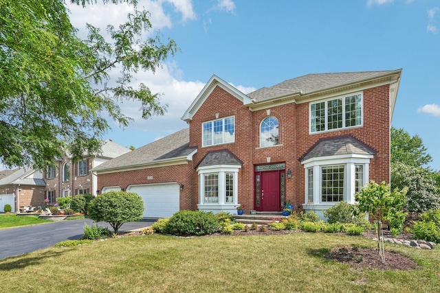 2524 Wild Timothy Rd, Naperville, IL 60564 - colonial-style house featuring a garage, brick siding, and asphalt driveway