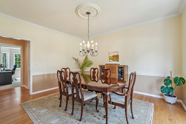 2524 Wild Timothy Rd, Naperville, IL 60564 - dining area with wood finished floors, crown molding, and a chandelier