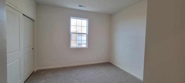 6473 Juniper Dr, Wonder Lake, IL 60097 - unfurnished bedroom featuring carpet floors and a closet