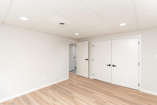 1121 S 13th St, Saint Charles, IL 60174 - unfurnished bedroom with light wood-type flooring, recessed lighting, a paneled ceiling, and a closet