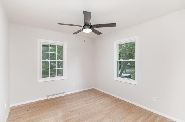 1121 S 13th St, Saint Charles, IL 60174 - empty room featuring healthy amount of natural light, light wood-type flooring, and a ceiling fan
